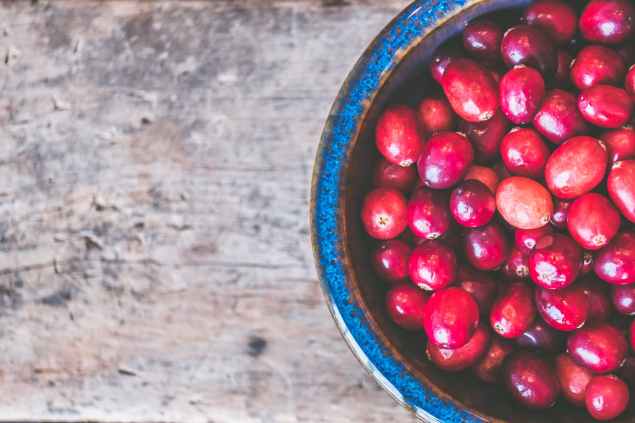 bowl of red round fruits
